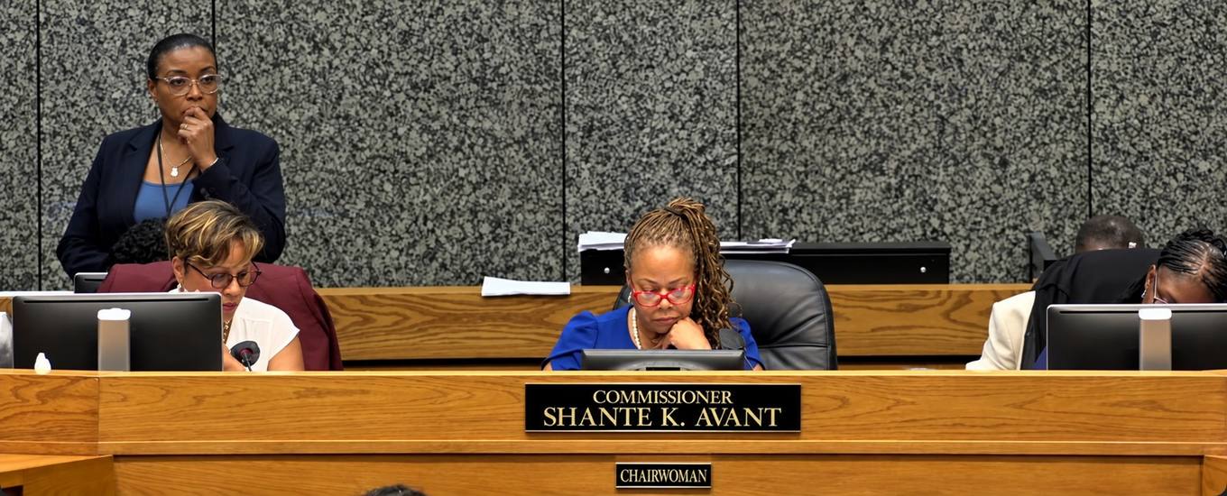 Shelby County Commission Chairwoman Shante K. Avant seated at the commission dais behind her nameplate.