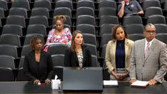 Four invited presenters stand at a hearing table during a Shelby County Commission meeting about the jail health care contract and its oversight provisions.