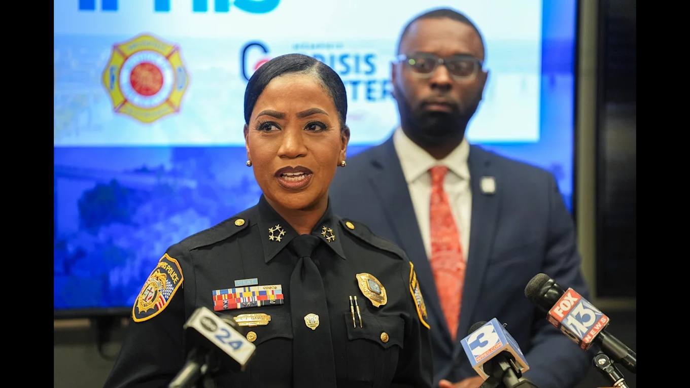 Memphis Police Chief Cerelyn "CJ" Davis speaks at a press conference on the city's new 911 behavioral health response option as Mayor Paul Young looks on.