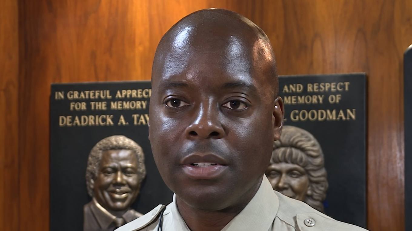 Shelby County Sheriff Anthony Buckner speaks at a podium in uniform.