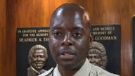 Shelby County Sheriff Anthony Buckner speaks at a podium in uniform.