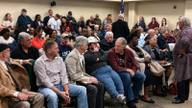 Residents fill the Columbia City Council chambers in Columbia, Tennessee, during a public meeting on proposed water-rate increases tied to the city's $520 million water infrastructure project.
