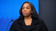 Federal Reserve Governor Lisa D. Cook listens during a press conference.