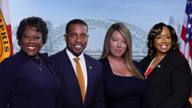 Councilwoman Yolanda Cooper-Sutton, Councilman JB Smiley Jr., Councilwoman Jerri Green, and Council Chairwoman Jana Swearengen-Washington stand together in front of a Memphis skyline backdrop.