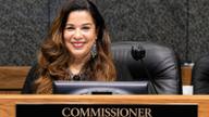 Commissioner Erika Sugarmon seated at the Shelby County Board of Commissioners dais behind her nameplate.