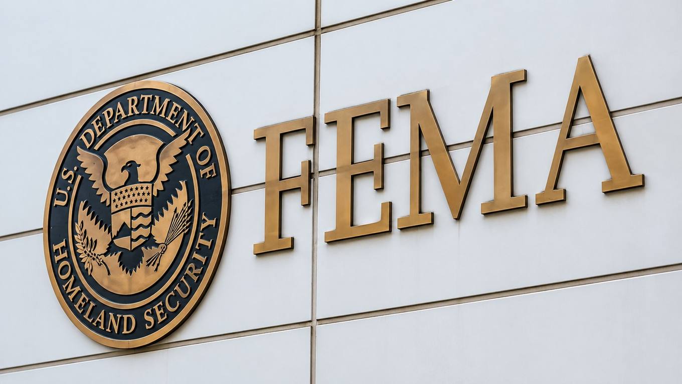 FEMA lettering and the U.S. Department of Homeland Security seal on a federal building facade.