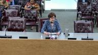 Danielle Schonbaum, Deputy Director of Administration and Finance for Shelby County, seated at the commission dais during a meeting.