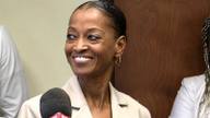 Shelby County Clerk Wanda Halbert smiles while speaking with reporters.