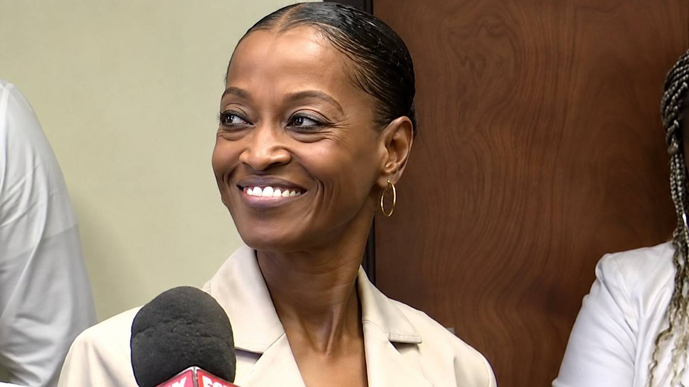 Shelby County Clerk Wanda Halbert smiles while speaking with reporters.