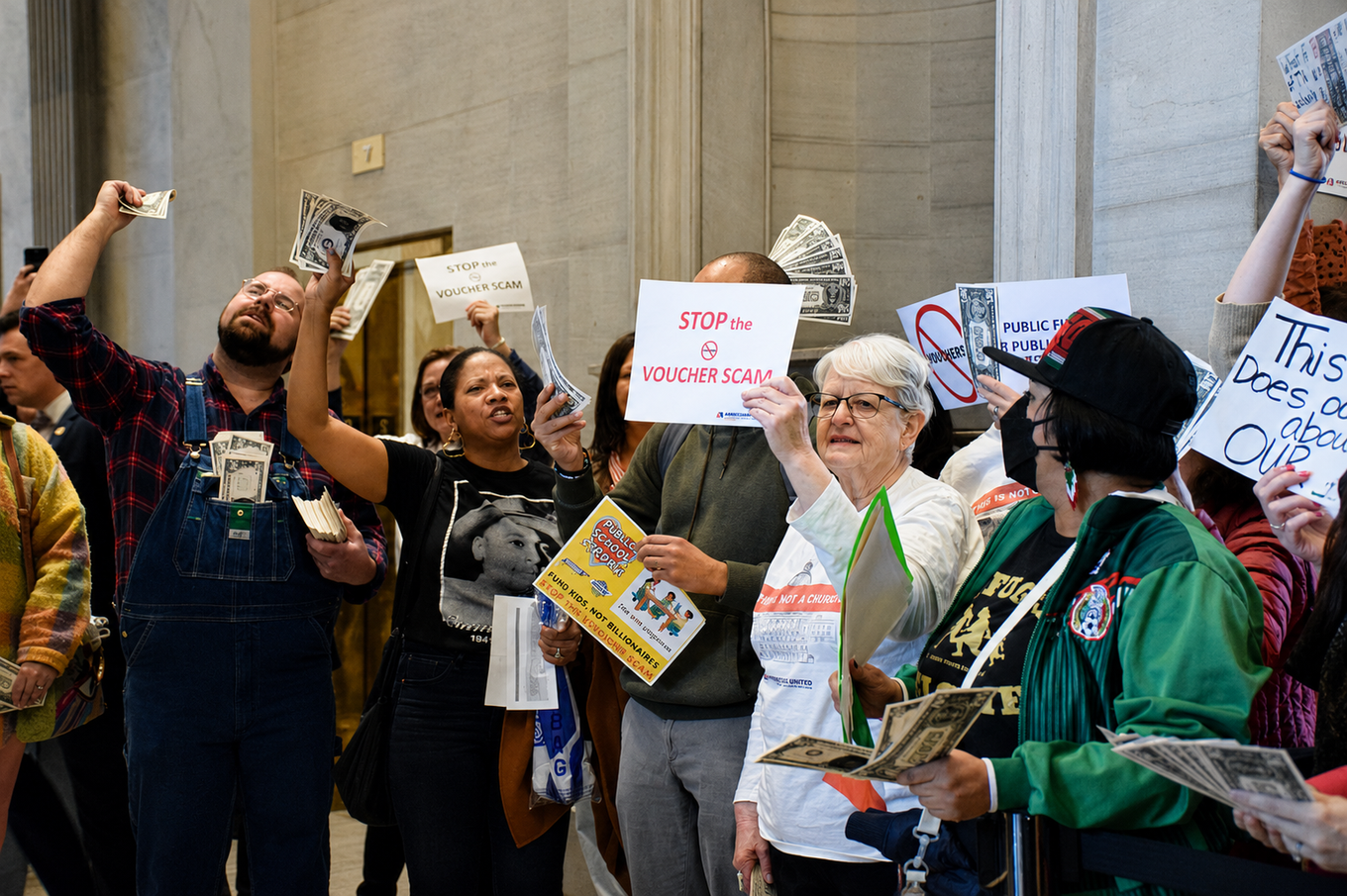 Protesters hold signs reading "STOP the VOUCHER SCAM" and wave dollar bills at the Tennessee State Capitol during a demonstration against Governor Bill Lee's education voucher plan.