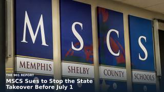 An empty Memphis school district board room with an American flag and a Tennessee state flag