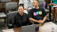 Two executives of the attraction operator seated at a witness table before a Memphis City Council committee.