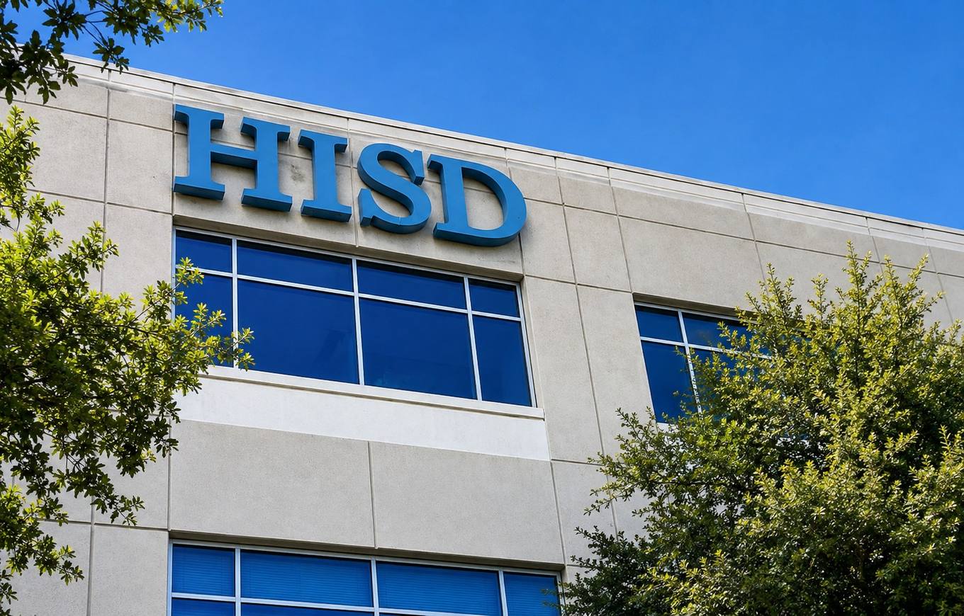 The exterior of the Houston Independent School District administration building on a clear day.