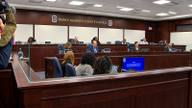 Prince George's County Council members seated at the dais inside the council chamber, with staff seated in the foreground.