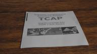 Tennessee Comprehensive Assessment Program test booklet on a table.