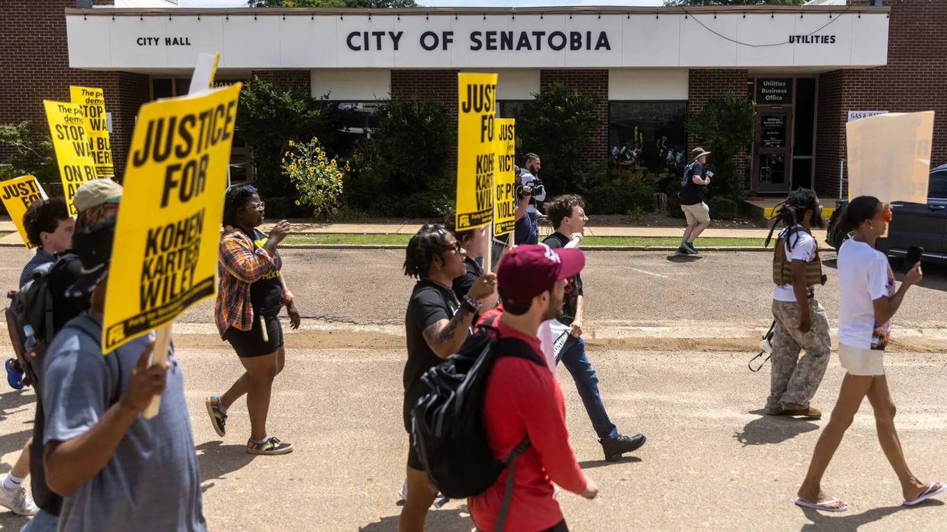 Protesters gather outside Senatobia City Hall in Senatobia, Mississippi, as controversy continues over the city's police chief.