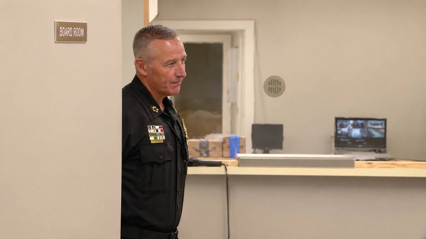 Senatobia Police Chief Harold Vanderford standing in a hallway outside the city board room.