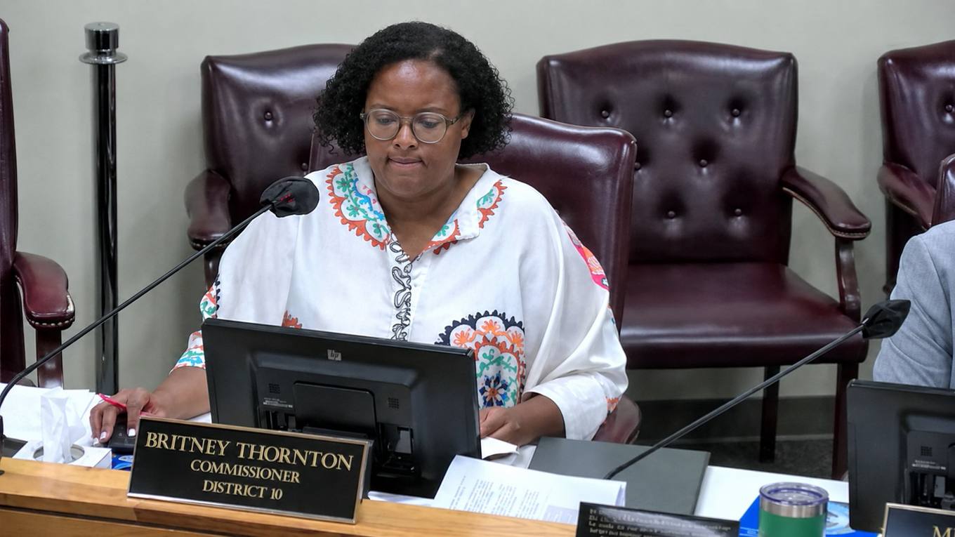 Shelby County Commissioner Britney Thornton, District 10, asks whether local data centers are current on their property taxes during a commission committee meeting, with a nameplate visible on the dais.