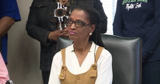 Shelby County Clerk Wanda Halbert seated at a public meeting.