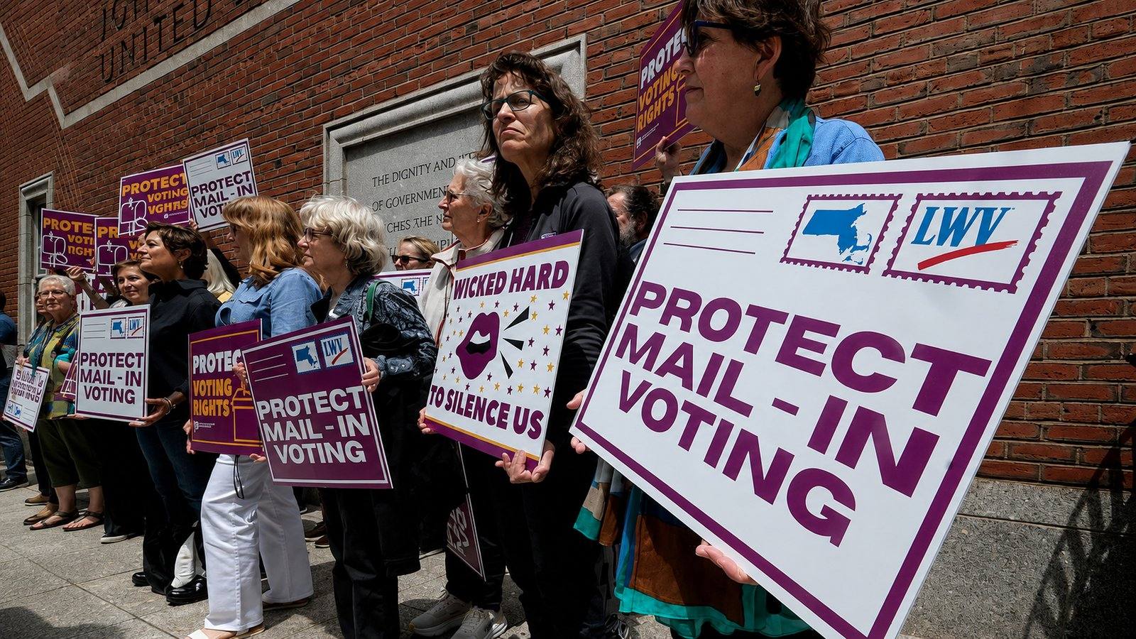 Supporters gather outside the federal courthouse in Boston on June 2, 2026, following a hearing in a lawsuit brought by a coalition of Democratic state attorneys general challenging President Donald Trump's executive order tightening rules on mail-in voting.