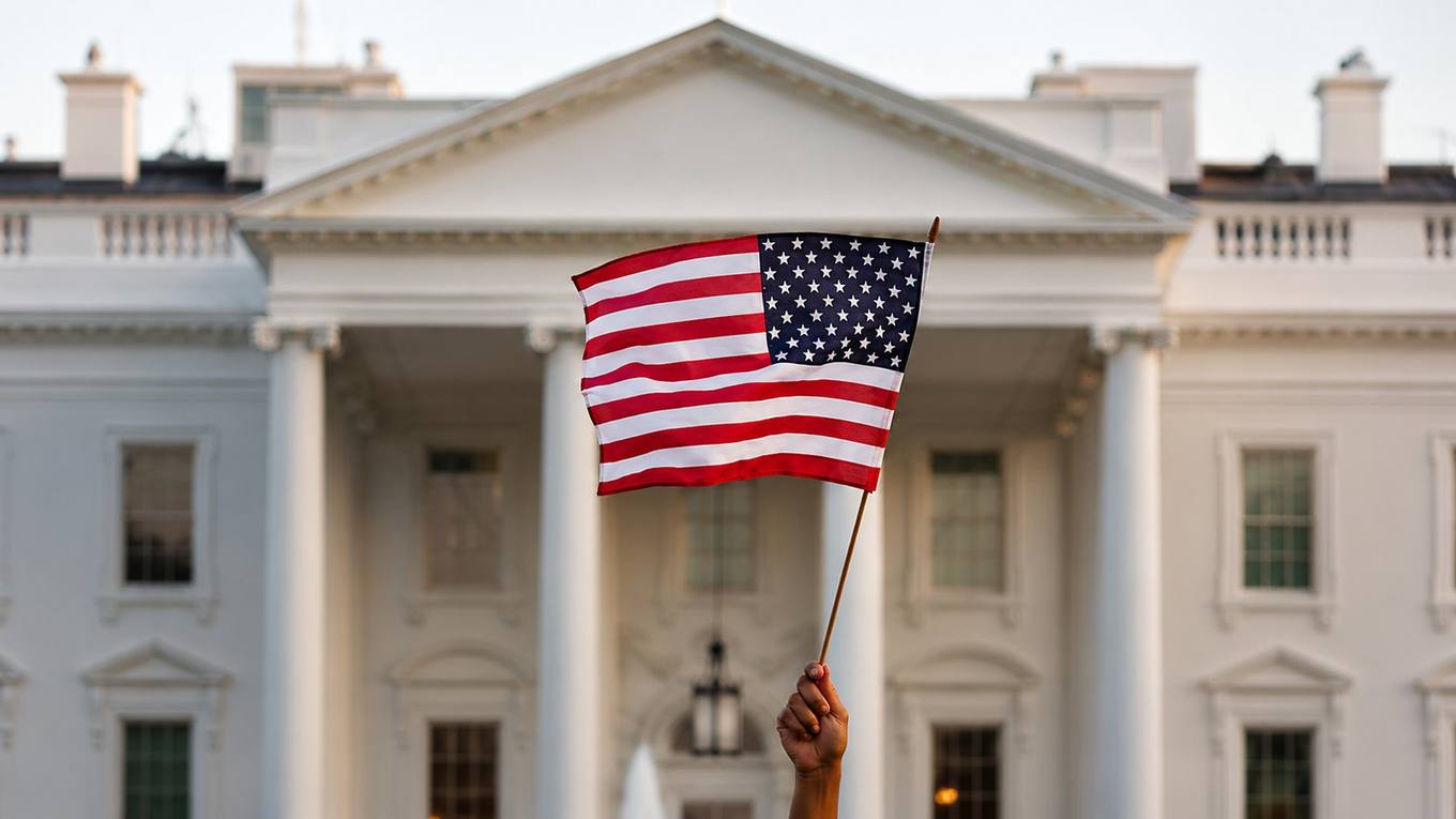 A protester holds an American flag outside the White House in Washington, D.C.